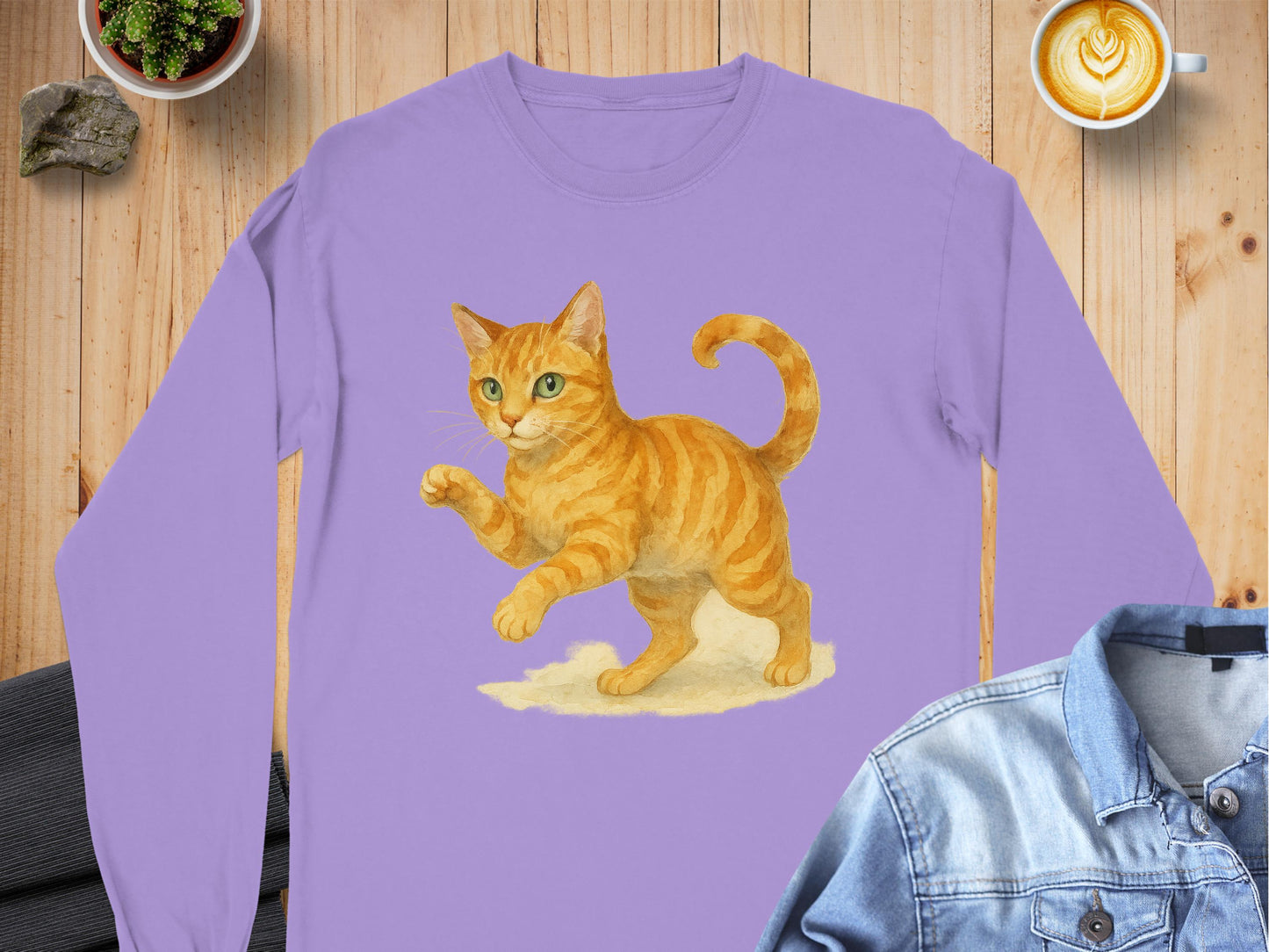 Playful Orange Cat Illustration on Purple shirt product