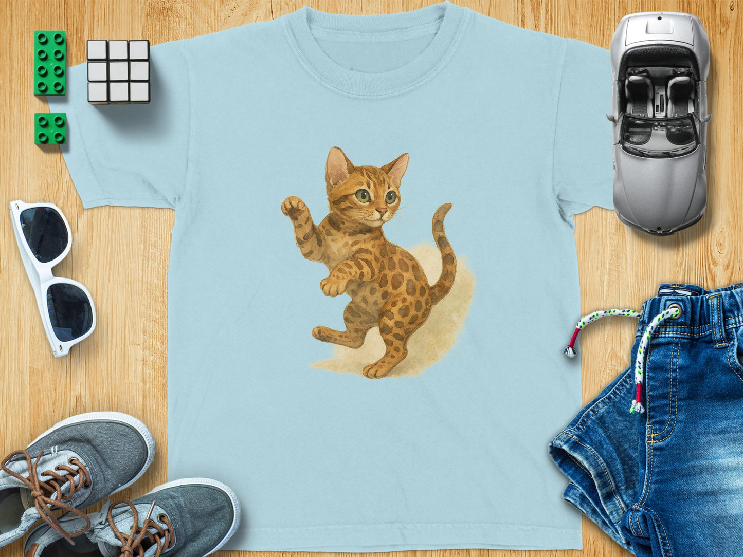 Playful Leopard Cat Design on Light Blue T-shirt product
