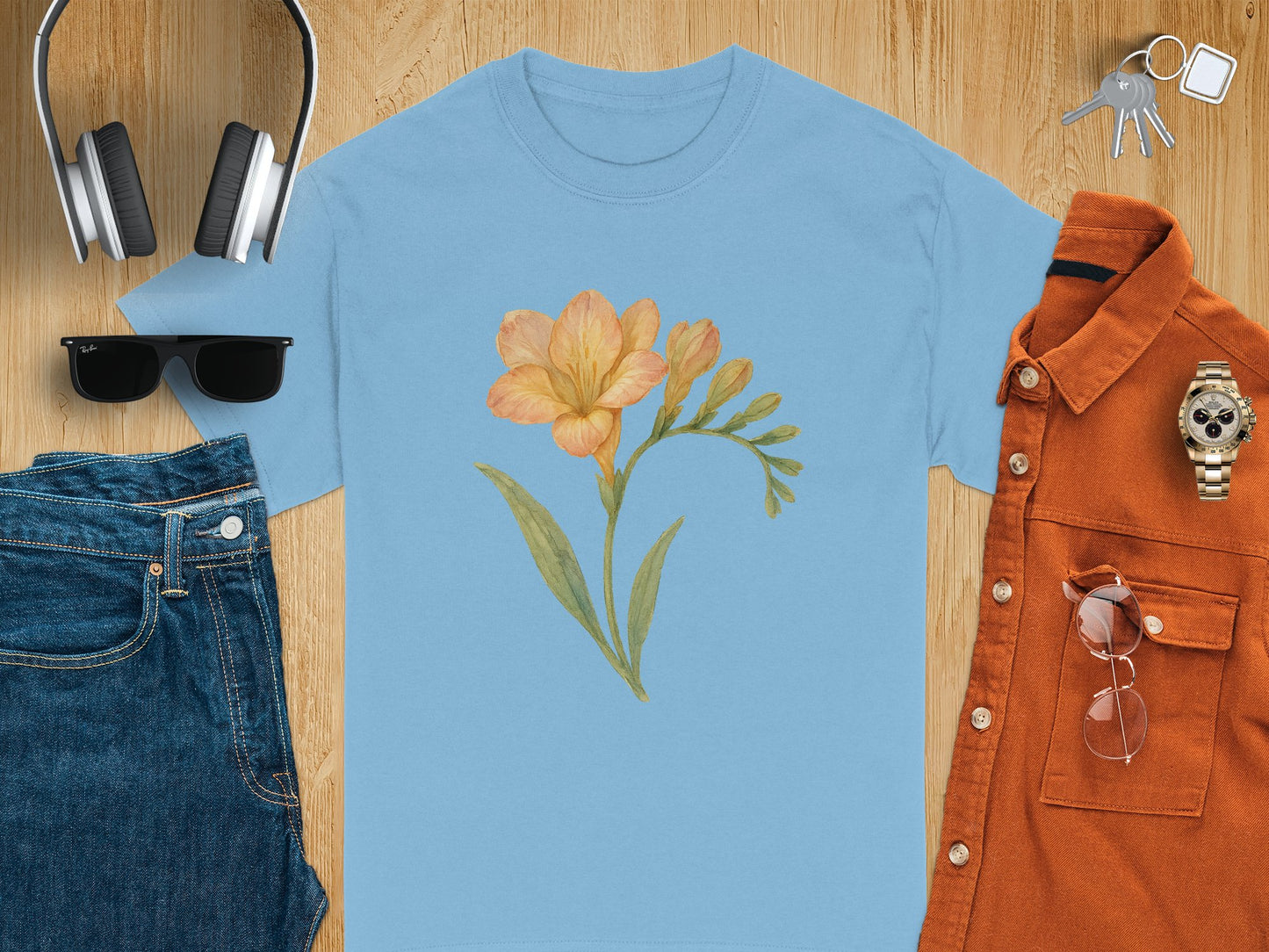 Orange Flower Design on Soft Blue Shirt product
