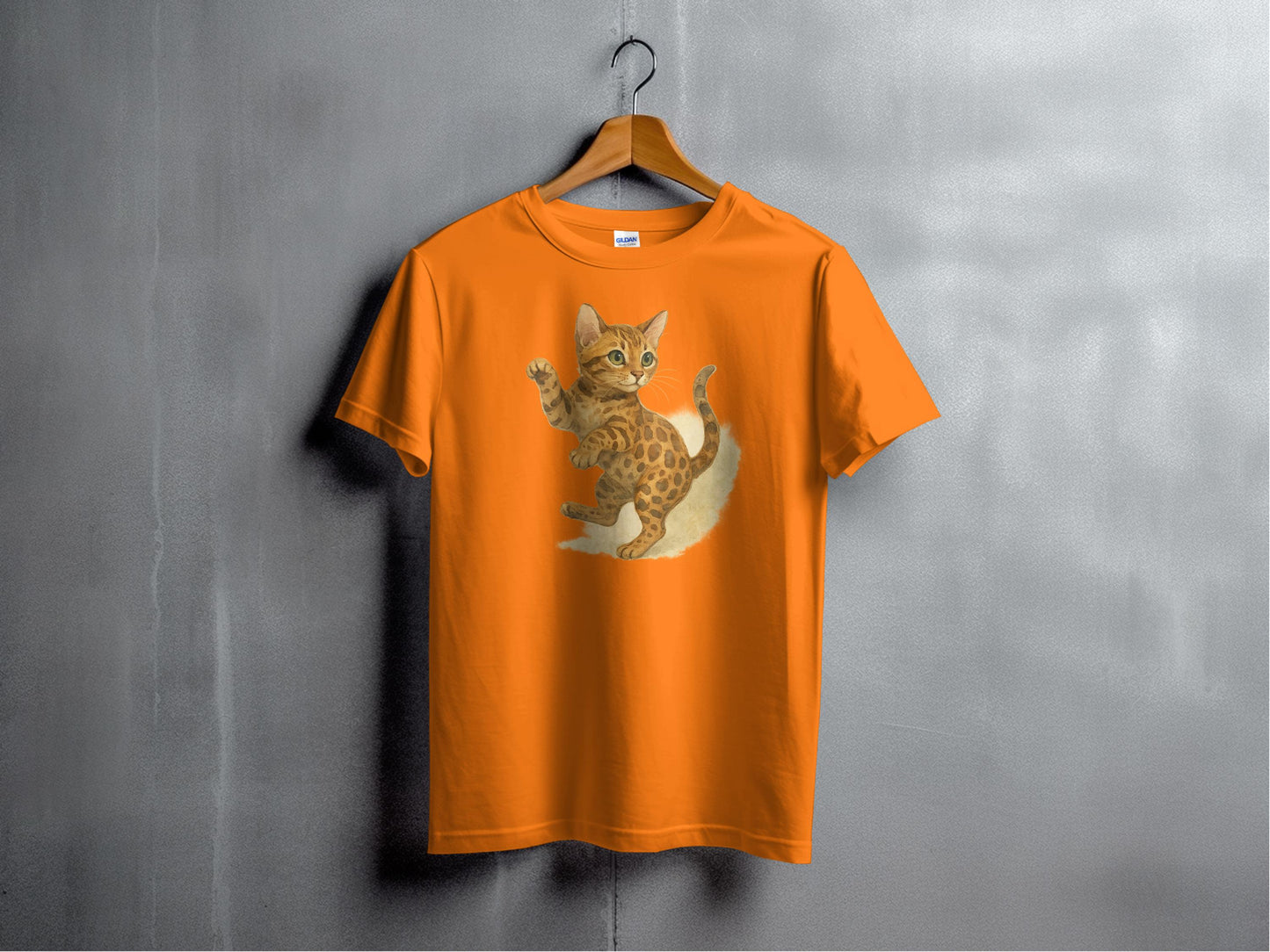 Playful Bengal Kitten Print on Vibrant Orange T-shirt product