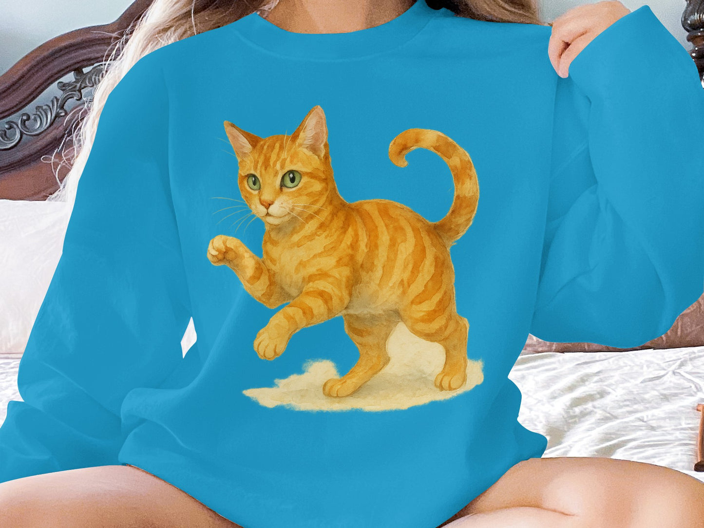 Playful Orange Cat Graphic on Blue Long Sleeve product