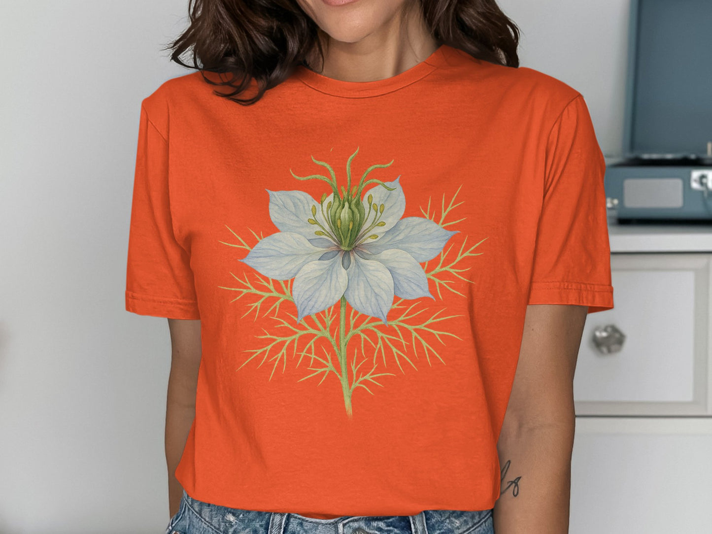 Vibrant Floral Design on Bright Orange T-shirt product