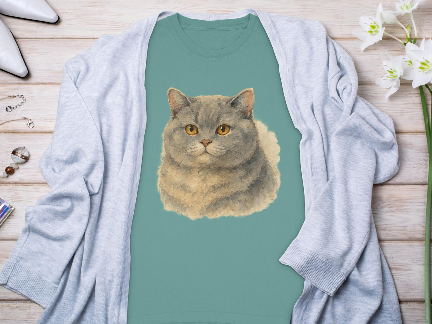 Adorable Round Faced Cat Design on Teal Shirt product