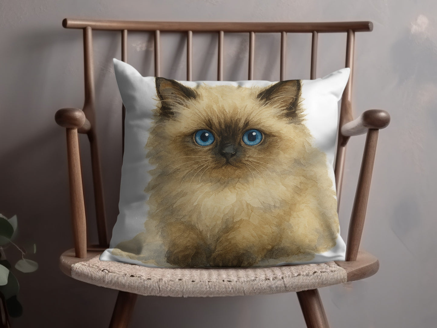 Fluffy blue-eyed kitten on a chair throw pillow product type