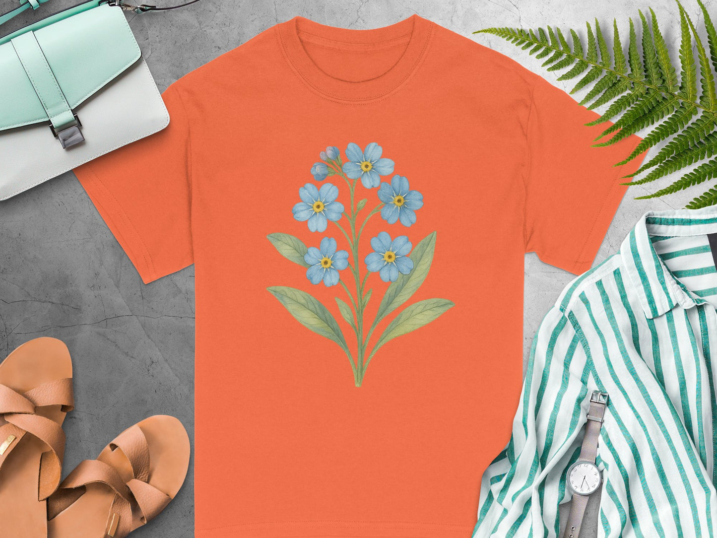 Vibrant Orange T-Shirt with Blue Floral Graphic Design product type