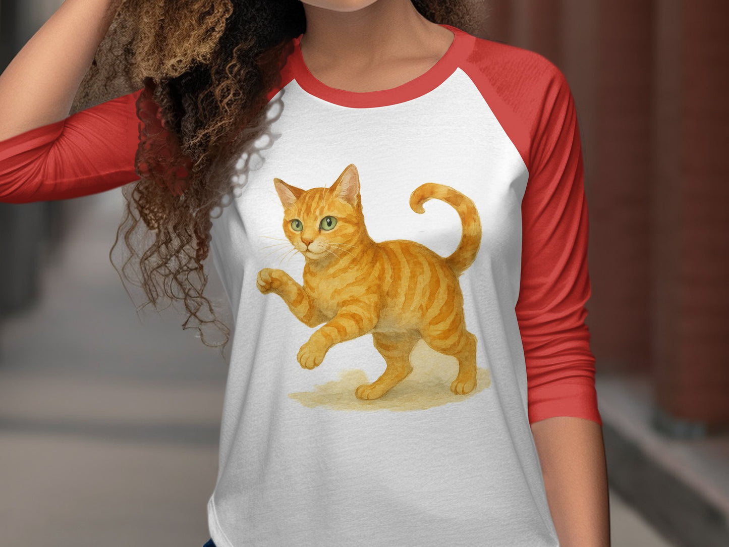 Playful Orange Cat on Red Sleeved Shirt product type