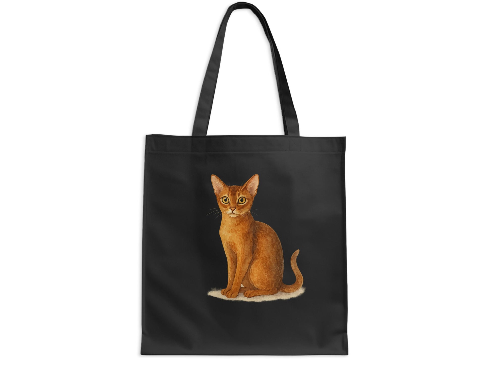Small cat sitting on black color fabric tote product type