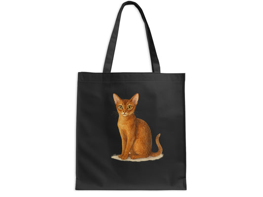 Small cat sitting on black color fabric tote product type