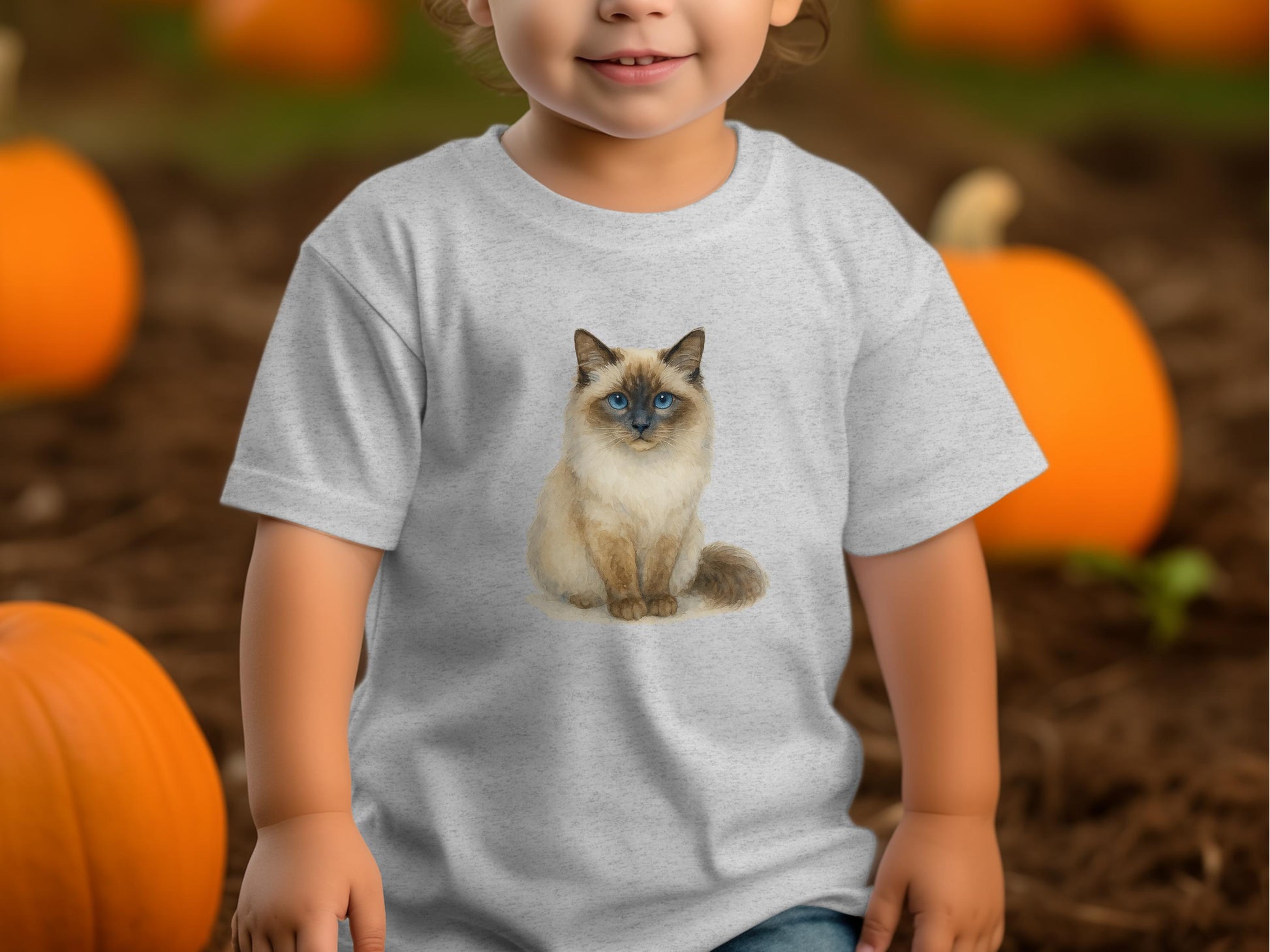 Cute Kid in Pumpkin Patch with Cat Shirt product