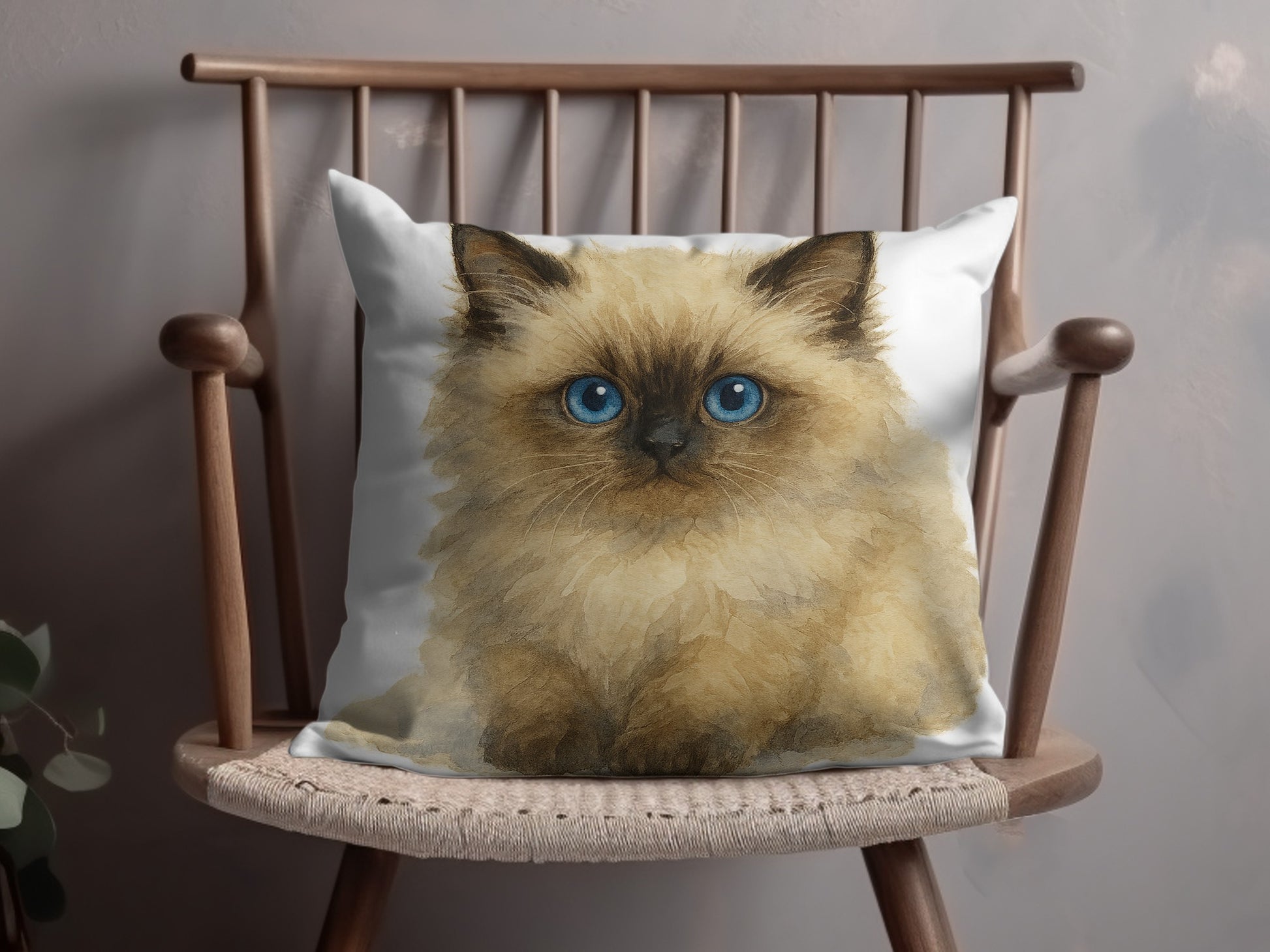 Fluffy blue-eyed kitten on a chair throw pillow product type