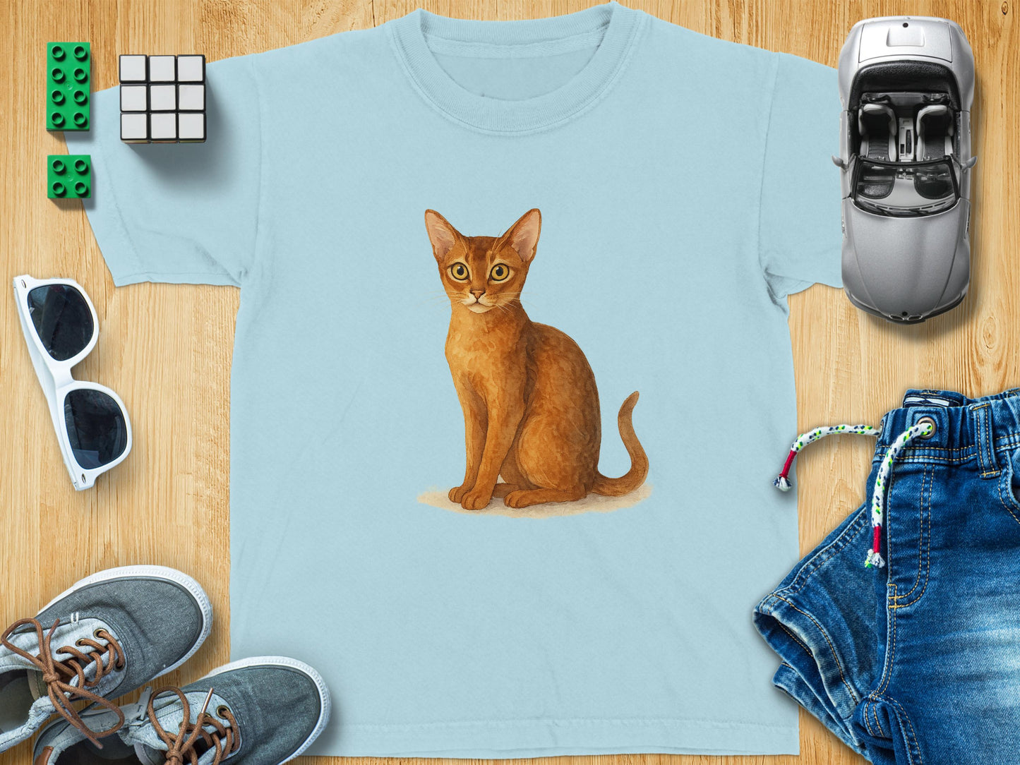 Cute Orange Cat Drawing on Light Blue T-Shirt product